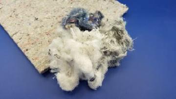 We produce needle punched nonwoven materials from post-industrial recycled textile fibre.